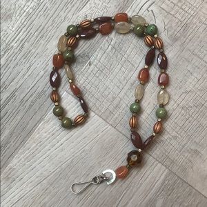 Brown and green lanyard for keys